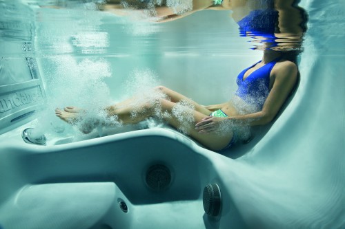 Woman relaxing in a hot tub.